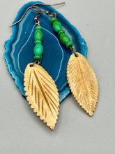 Load image into Gallery viewer, Single-stranded earring features bone carved leaf charm earrings with bright green magnesite stone beads. Antique Copper Plated Surgical Steel Hammered Long Ear-wire French Hook Earrings. Measurements: 3” in length