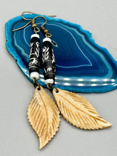 Load image into Gallery viewer, Single-stranded earring features bone carved leaf charm earrings with black and white bone carved floral design beads. Antique brass-plated steel ear-wire French Hook Earrings.   Measurements: 3” in length
