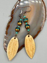 Load image into Gallery viewer, Single-stranded earring features bone carved leaf charm earrings with aqua and copper faceted glass round glass beads. Antique Copper Plated Surgical Steel Hammered Long Ear-wire French Hook Earrings.   Measurements: 3” in length