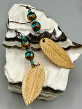 Load image into Gallery viewer, Single-stranded earring features bone carved leaf charm earrings with aqua and copper faceted glass round glass beads. Antique Copper Plated Surgical Steel Hammered Long Ear-wire French Hook Earrings.   Measurements: 3” in length