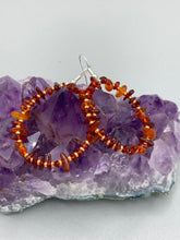 Load image into Gallery viewer, These hoop earrings feature natural amber stone chips and gold glass beads for an elegant, nature-inspired look. Measurements: 2" length and 2” in width