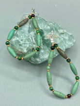 Load image into Gallery viewer, These stylish fish hook style earrings feature intricate beadwork crafted with forest green magnesite and ruby zoisite stones. Measurements: 2 3/4" length