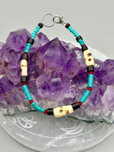 Load image into Gallery viewer, These stylish skull bracelet is perfect for adding a unique flair to any outfit. Whether you're looking for a Dia De Los Muertos accessory or simply looking to draw inspiration, these goth pieces perfectly capture the vampire goth, witchy, dark, Chingona Cabrona, Latina Chicana styles. Skull-shaped bone beads adorned with dark brown, turquoise, and gold beads make up this unique statement piece. Measurements: Bracelet: 7 1/2"