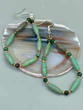 Load image into Gallery viewer, These stylish fish hook style earrings feature intricate beadwork crafted with forest green magnesite and ruby zoisite stones. Measurements: 2 3/4" length