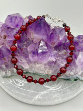 Load image into Gallery viewer, Single-strand dark red round glass beaded bracelet with dark red faceted crystals. Crafted with metal wire and fastened with a lobster claw clasp.  Measurements:   Bracelet: 8" in length