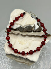 Load image into Gallery viewer, Single-strand dark red round glass beaded bracelet with dark red faceted crystals. Crafted with metal wire and fastened with a lobster claw clasp.  Measurements:   Bracelet: 8" in length