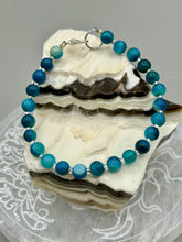 Load image into Gallery viewer, Nature inspired single-strand sea blue stripped agate round stone beaded with silver glass beaded bracelet. Crafted with metal wire and fastened with a lobster claw clasp. Measurements: Bracelet: 8" in length