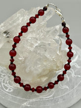 Load image into Gallery viewer, Single-strand dark red round glass beaded bracelet with dark red faceted crystals. Crafted with metal wire and fastened with a lobster claw clasp.  Measurements:   Bracelet: 8" in length