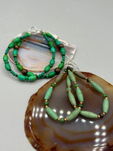 Load image into Gallery viewer, These stylish fish hook style earrings feature intricate beadwork crafted with forest green magnesite and ruby zoisite stones. Measurements: 2 3/4" length