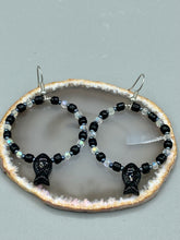 Load image into Gallery viewer, This sophisticated pair of earrings features a black glass fish bead, complemented by small iridescent and dark gray color glass beads, with eye and fin details. Measurements: 2” in length