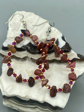 Load image into Gallery viewer, These pure rhodonite stone chip earrings with lustrous fuchsia and gold glass beading boast shimmering accents of blue, gold, and purple. Measurements: 2 1/4" length