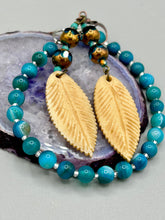 Load image into Gallery viewer, Single-stranded earring features bone carved leaf charm earrings with aqua and copper faceted round glass beads. Antique Copper Plated Surgical Steel Hammered Long Ear-wire French Hook Earrings. Measurements: 3” in length