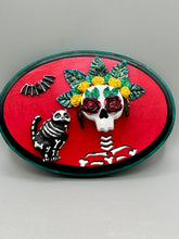 Load image into Gallery viewer, La Catrina y Gatita wall art is the purrfect hanging Day of the Dead art piece to add to your ofrenda. A tribute to an unbreakable bond and eternal love between cats and their guardians. Featuring a vibrant and intricate detail catrina and her floral crown and her kitty cat companion, this Day of the Dead-inspired artwork adds a little touch of Mexican art to your home or office. A unique handcrafted gift for any cat lover.