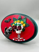 Load image into Gallery viewer, La Catrina y Gatita wall art is the purrfect hanging Day of the Dead art piece to add to your ofrenda. A tribute to an unbreakable bond and eternal love between cats and their guardians. Featuring a vibrant and intricate detail catrina and her floral crown and her kitty cat companion, this Day of the Dead-inspired artwork adds a little touch of Mexican art to your home or office. A unique handcrafted gift for any cat lover.