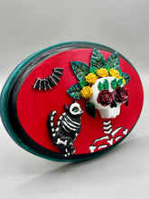 Load image into Gallery viewer, La Catrina y Gatita wall art is the purrfect hanging Day of the Dead art piece to add to your ofrenda. A tribute to an unbreakable bond and eternal love between cats and their guardians. Featuring a vibrant and intricate detail catrina and her floral crown and her kitty cat companion, this Day of the Dead-inspired artwork adds a little touch of Mexican art to your home or office. A unique handcrafted gift for any cat lover.