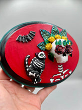 Load image into Gallery viewer, La Catrina y Gatita wall art is the purrfect hanging Day of the Dead art piece to add to your ofrenda. A tribute to an unbreakable bond and eternal love between cats and their guardians. Featuring a vibrant and intricate detail catrina and her floral crown and her kitty cat companion, this Day of the Dead-inspired artwork adds a little touch of Mexican art to your home or office. A unique handcrafted gift for any cat lover.