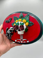 Load image into Gallery viewer, La Catrina y Gatita wall art is the purrfect hanging Day of the Dead art piece to add to your ofrenda. A tribute to an unbreakable bond and eternal love between cats and their guardians. Featuring a vibrant and intricate detail catrina and her floral crown and her kitty cat companion, this Day of the Dead-inspired artwork adds a little touch of Mexican art to your home or office. A unique handcrafted gift for any cat lover.