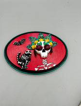 Load image into Gallery viewer, La Catrina y Gatita wall art is the purrfect hanging Day of the Dead art piece to add to your ofrenda. A tribute to an unbreakable bond and eternal love between cats and their guardians. Featuring a vibrant and intricate detail catrina and her floral crown and her kitty cat companion, this Day of the Dead-inspired artwork adds a little touch of Mexican art to your home or office. A unique handcrafted gift for any cat lover.