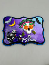 Load image into Gallery viewer, Frida Kahlo Inspired Wall Art | Dia De Los Muertos Home Decor. La Catrina y Gatita wall art is the purrfect hanging Day of the Dead art piece to add to your ofrenda. A tribute to an unbreakable bond and eternal love between cats and their guardians. Featuring a vibrant and intricate detail catrina and her floral crown and her kitty cat companion, this Day of the Dead-inspired artwork adds a little touch of Mexican art to your home or office. A unique handcrafted gift for any cat lover.