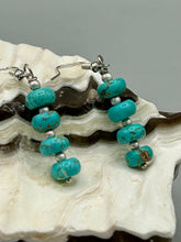 Load image into Gallery viewer, These earrings feature a single strand constructed with quartzite turquoise stone and silver glass beaded earrings. A pair of unique, nature-inspired look. Measurements: 1 1/4" length