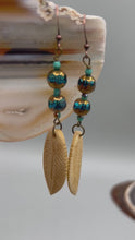 Load and play video in Gallery viewer, Bone Carved Leaf Charm Earrings, Aqua And Copper Faceted Glass Round Beaded Earrings