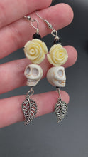 Load and play video in Gallery viewer, Frida Kahlo Inspired Earring, Dangling Howlite Skull Beads White Roses, Pastel Goth, Dia De Los Muertos Calavera, Day of the Dead Jewelry, La Catrina