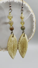 Load and play video in Gallery viewer, Bone Carved Leaf Charm Earrings, Champagne Mix Melon Czech Round Glass Beaded Earrings
