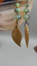 Load and play video in Gallery viewer, Bone Carved Leaf Charm Earrings, Mint Faceted Round Glass Beaded Earrings