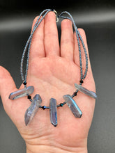 Load image into Gallery viewer, This sophisticated double-strand necklace glitters with silver and gray-tone glass beads, complemented by luminous blue crystal stone nuggets. It gracefully drapes around the neck. Measurements:  Necklace is 15 1/4”adjustable up to 17" in length