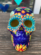 Load image into Gallery viewer, I wanted to create a skully that represented the eternal love for a special kitty cat in your life. Dark royal blue ceramic sugar skull with black cat silhouette is sitting admiring the sun going down. This Day Of The Dead ceramic skull art was created for the cat lovers who adore their sweet kitty. Measurements: H 4” x W 4” x D 5 1/2”