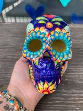 Load image into Gallery viewer, I wanted to create a skully that represented the eternal love for a special kitty cat in your life. Dark royal blue ceramic sugar skull with black cat silhouette is sitting admiring the sun going down. This Day Of The Dead ceramic skull art was created for the cat lovers who adore their sweet kitty. Measurements: H 4” x W 4” x D 5 1/2”