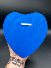 Load image into Gallery viewer, Frida Kahlo inspired calavera with a dark wood frame, this Day of the Dead wall decor piece is perfect for adding a traditional Mexican folk art touch to any home. Featuring an intricately detailed clay calavera in the style of Frida Kahlo, this Day of the Dead wall art decor is sure to be the centerpiece of any home décor. The calavera is wearing Frida's iconic crown of flowers and with several butterflies around her, ensuring it will bring both a unique and inspiring look to any wall.