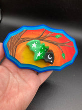 Load image into Gallery viewer, This unique Starry Night Mini Bat Wall Art Decor is hand sculpted and painted in vivid hues to offer an eye-catching decoration for your living space. The bat is painted in a gradient of light green to dark green to black, and is complemented by white stars and a crescent moon. The wood frame is painted in yellow, orange and red for a stunning sundown effect, with a royal blue edge for added contrast.