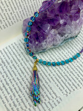 Load image into Gallery viewer, This necklace boasts a stunning Rainbow Kyanite wired stone pendant and two strands of shimmering glass beads. The blues contain hues of pink, gold, blue and green, offering a vibrant and bold addition to any jewelry collection. Measurements: Necklace is 17” in length, can be adjusted to 18"