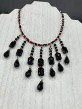 Load image into Gallery viewer, This Vampire Goth style choker necklace features a mix of black and red glass beads with a hanging large tear drop black bead that gives it a depth and complexity of color. Perfect for formal dresses as it gracefully drapes down the neck. Necklace is 15” adjustable to 18"