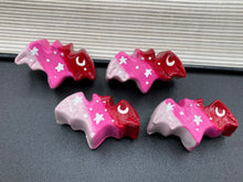 Load image into Gallery viewer, Cute and spooky magnet design to adorn your refrigerator, lockers, workstation, toolbox, or dishwasher. This hand-sculpted clay bat statuette boasts stunning ombre coloration, transitioning from dark red to light pink to recreate the breathtaking look of a starry night sky. H 1” x W 2” x D 1/2”
