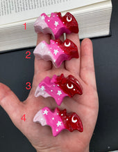 Load image into Gallery viewer, Cute and spooky magnet design to adorn your refrigerator, lockers, workstation, toolbox, or dishwasher. This hand-sculpted clay bat statuette boasts stunning ombre coloration, transitioning from dark red to light pink to recreate the breathtaking look of a starry night sky. H 1” x W 2” x D 1/2”