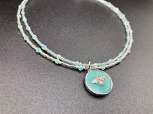 Load image into Gallery viewer, Make a statement with this dainty, yet bold Amazonite Bee Pendant Necklace. Beautifully beaded with frosty glass in blue and silver tones, this shabby chic jewelry piece complements any outfit. The perfect combination of hues and shapes will add complexity and elegance to your look. Measurements: Necklace is 17” in length