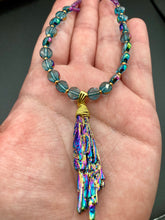Load image into Gallery viewer, This necklace boasts a stunning Rainbow Kyanite wired stone pendant and two strands of shimmering glass beads. The blues contain hues of pink, gold, blue and green, offering a vibrant and bold addition to any jewelry collection. Measurements: Necklace is 17” in length, can be adjusted to 18"