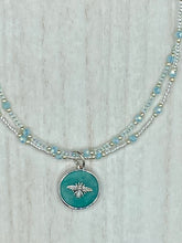 Load image into Gallery viewer, Make a statement with this dainty, yet bold Amazonite Bee Pendant Necklace. Beautifully beaded with frosty glass in blue and silver tones, this shabby chic jewelry piece complements any outfit. The perfect combination of hues and shapes will add complexity and elegance to your look. Measurements: Necklace is 17” in length
