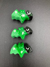 Load image into Gallery viewer, Cute and spooky magnet design to adorn your refrigerator, lockers, workstation, toolbox, or dishwasher. This hand-sculpted clay bat statuette boasts stunning ombre coloration, transitioning from black to dark green to light green to recreate the breathtaking look of a starry night sky. H 1” x W 2” x D 1/2”