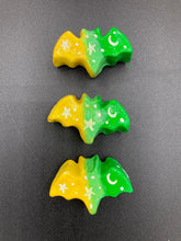 Load image into Gallery viewer, Cute and spooky magnet design to adorn your refrigerator, lockers, workstation, toolbox, or dishwasher. This hand-sculpted clay bat statuette boasts stunning ombre coloration, transitioning from to dark green to light green and then to bright yellow to recreate the breathtaking look of a starry night sky. H 1” x W 2” x D 1/2”