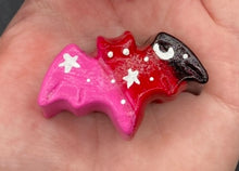 Load image into Gallery viewer, Cute and spooky magnet design to adorn your refrigerator, lockers, workstation, toolbox, or dishwasher. This hand-sculpted clay bat statuette boasts stunning ombre coloration, transitioning from black to dark red to pink to recreate the breathtaking look of a starry night sky. H 1” x W 2” x D 1/2”