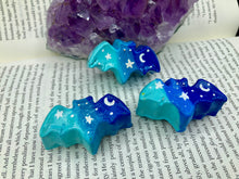 Load image into Gallery viewer, Cute and spooky magnet design to adorn your refrigerator, lockers, workstation, toolbox, or dishwasher. This hand-sculpted clay bat statuette boasts stunning ombre coloration, transitioning from dark blue to light blue to recreate the breathtaking look of a starry night sky. H 1” x W 2” x D 1/2”