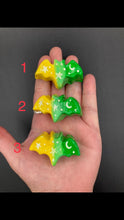 Load image into Gallery viewer, Cute and spooky magnet design to adorn your refrigerator, lockers, workstation, toolbox, or dishwasher. This hand-sculpted clay bat statuette boasts stunning ombre coloration, transitioning from to dark green to light green and then to bright yellow to recreate the breathtaking look of a starry night sky. H 1” x W 2” x D 1/2”