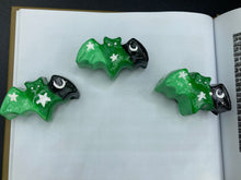 Load image into Gallery viewer, Cute and spooky magnet design to adorn your refrigerator, lockers, workstation, toolbox, or dishwasher. This hand-sculpted clay bat statuette boasts stunning ombre coloration, transitioning from black to dark green to light green to recreate the breathtaking look of a starry night sky. H 1” x W 2” x D 1/2”