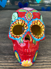 Load image into Gallery viewer, This uniquely handpainted ceramic skull is inspired by the beauty of Sedona, AZ. Features bold fire red color with nature-inspired design for a truly one-of-a-kind mini calavera. Perfect for adding a southwestern touch to your Dia de Los Muertos ofrenda. Measurements: H 4” x W 4” x D 5 1/2”