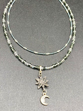 Load image into Gallery viewer, This Dainty Smiling Crescent Moon And Star Silver And Gray Choker Style Necklace features a variety of shimmering glass beads in light silver and gray tones. Varying in shape and size, these beads lend a unique and witchy celestial vibe to the necklace.  Measurements:  Necklace is 15 3/4”adjustable up to 18"