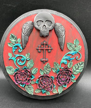 Load image into Gallery viewer, This Memento Mori Wall Art Decor is a one-of-a-kind art piece, skillfully crafted with a black polymer clay skull and wings on a dark red wood frame, decoratively woven with dark red roses and vines. It's perfect for adding an eye-catching touch to any wall and makes a unique, bold gift.  Measurements:  Diameter 6 3/4" x Depth 1 1/2"