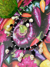 Load image into Gallery viewer, This sophisticated, yet dark-themed necklace utilizes small howlite skull beads along with black and white quartize floral beads to capture the iconic floral crown of Frida Kahlo. This Chingona, Cabrona, Latina Chicana, Goth, Vampire Goth, Dark Witchy Style jewelry can be used to inspire and to celebrate Dia de los Muertos. Equally suitable for dressy and casual outfits, the piece gives a unique edge to any look.